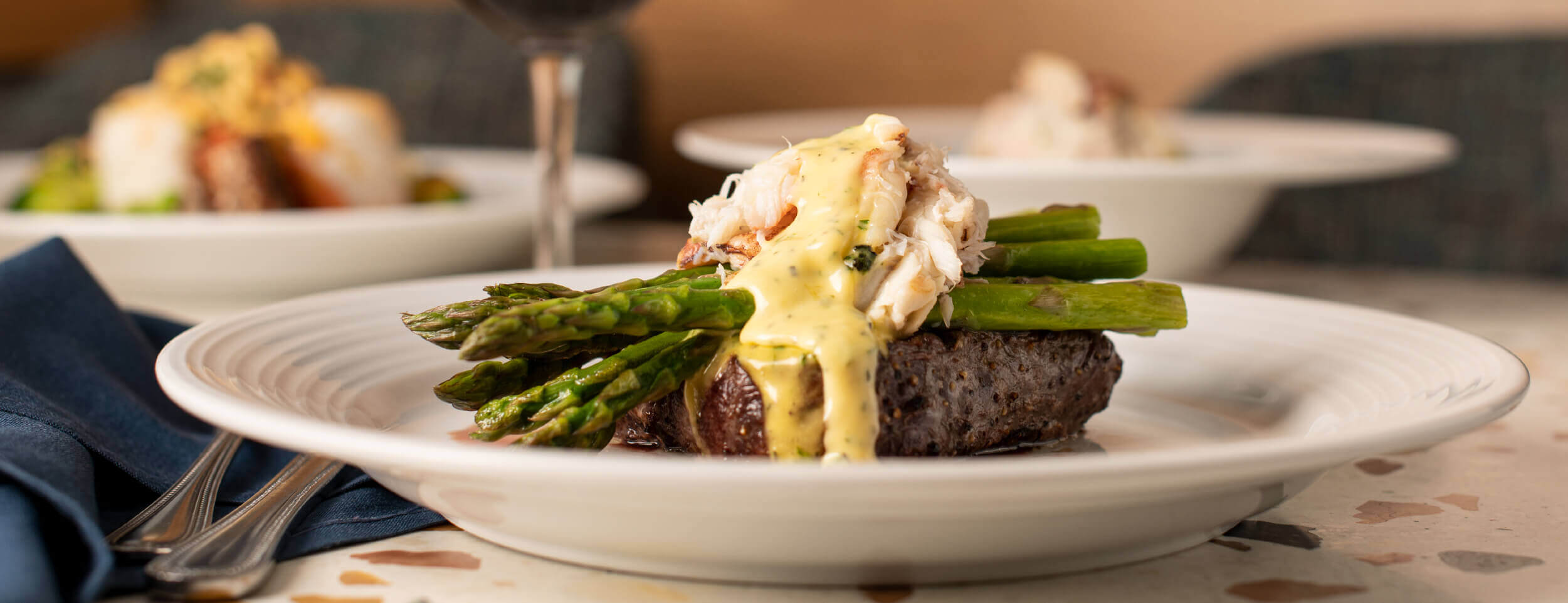 Georgie's steak "Oscar Style" (topped with Fresh Dungeness Crab, Béarnaise, Asparagus).
