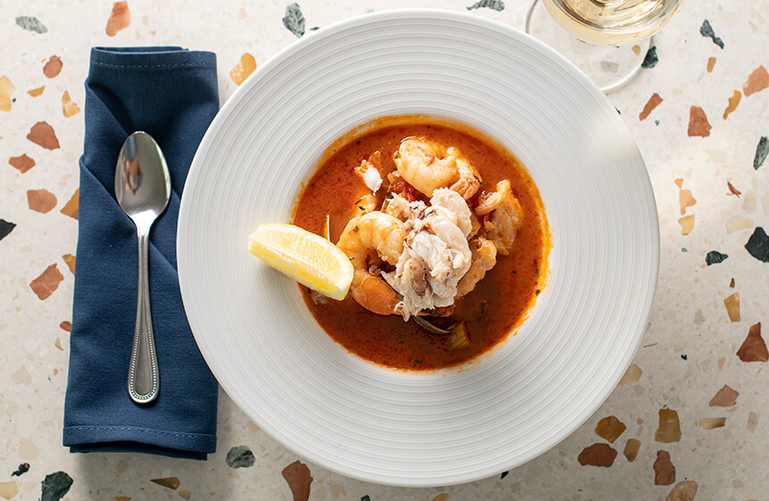 Clams, Northwest cod, shrimp, wild salmon, calamari, fresh Dungeness crab, Newport bay shrimp, fresh herbs, and white wine simmered in a zesty tomato broth. Served with Parmesan garlic bread.