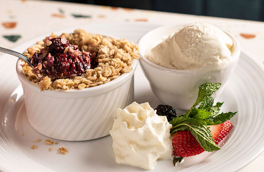 Local marionberries topped with a brown sugar, oatmeal, and butter crumble. Served warm with a scoop of Tillamook® Vanilla Bean ice cream.